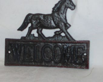 Cast iron horse  Welcome wall plaque rusty black and green with rusty red border hand painted