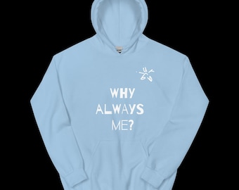 May include: A light blue hoodie with the text "WHY ALWAYS ME?" in white block letters. A small white graphic is above the text. The hoodie has a hood and a front pocket.