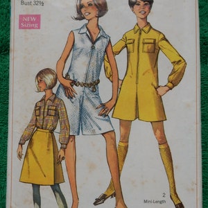 May include: Simplicity sewing pattern number 7487 for a dress. The pattern includes three different styles: a sleeveless dress with a zipper, a long-sleeved dress with pockets, and a short-sleeved dress with a skirt. The pattern is for sizes 10 and 32 1/2 bust.