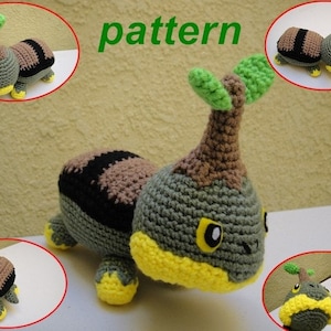 May include: A crocheted plush toy in the shape of a creature with a bulbous head and a segmented body. The toy features a green, brown, black, and yellow color scheme. The word "pattern" is written in green on the image.