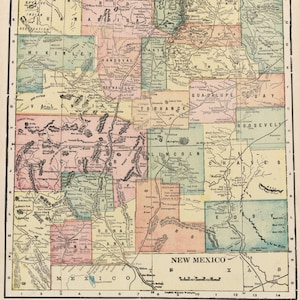 May include: A vintage map of New Mexico, featuring a detailed depiction of the state's counties. The map is divided into rectangular sections, each representing a county, with names like McKinley, Sandoval, and Lincoln. The color palette includes pastel shades of pink, green, and yellow.