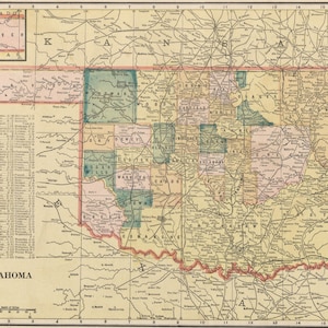 May include: A vintage map of Oklahoma, featuring detailed county lines and names. The map is in muted tones of beige, pink, green, and yellow, with a small inset map of surrounding states. The word "Oklahoma" is printed in bold letters at the bottom.