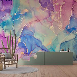 May include: Abstract wall art featuring a colourful, swirling design in shades of blue, purple, and pink with gold accents. The design resembles liquid marble or watercolour.