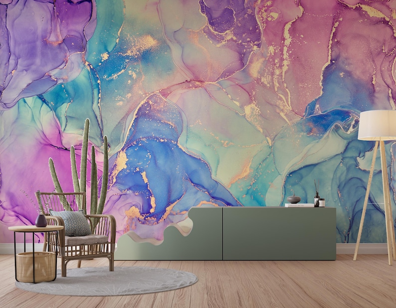 May include: Abstract wall art featuring a colourful, swirling design in shades of blue, purple, and pink with gold accents. The design resembles liquid marble or watercolour.