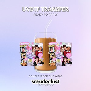 May include: A clear glass cup filled with a tan beverage and a clear straw, featuring a colorful UVDTF transfer wrap with Clueless movie imagery, including film strips, pink heels, a cassette tape, and the text UGH and SHOP on both sides.