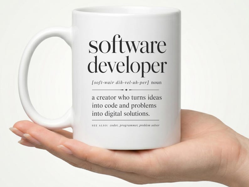 Mug with "software developer" definition and related terms.