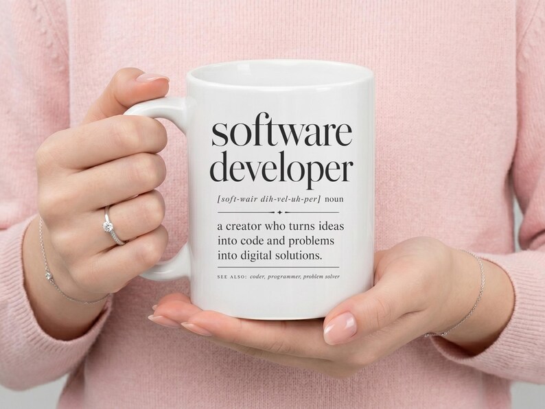 White mug with "software developer" definition and related terms.
