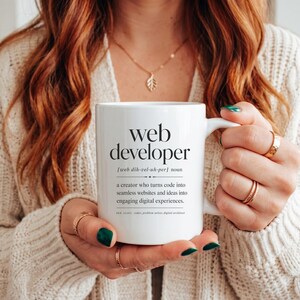 Mug with "web developer" definition and humorous synonyms.