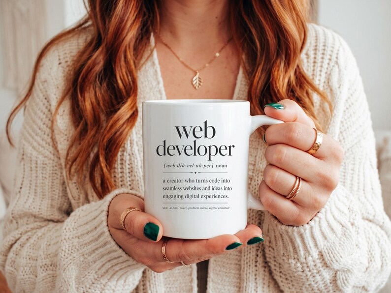 Mug with "web developer" definition and humorous synonyms.