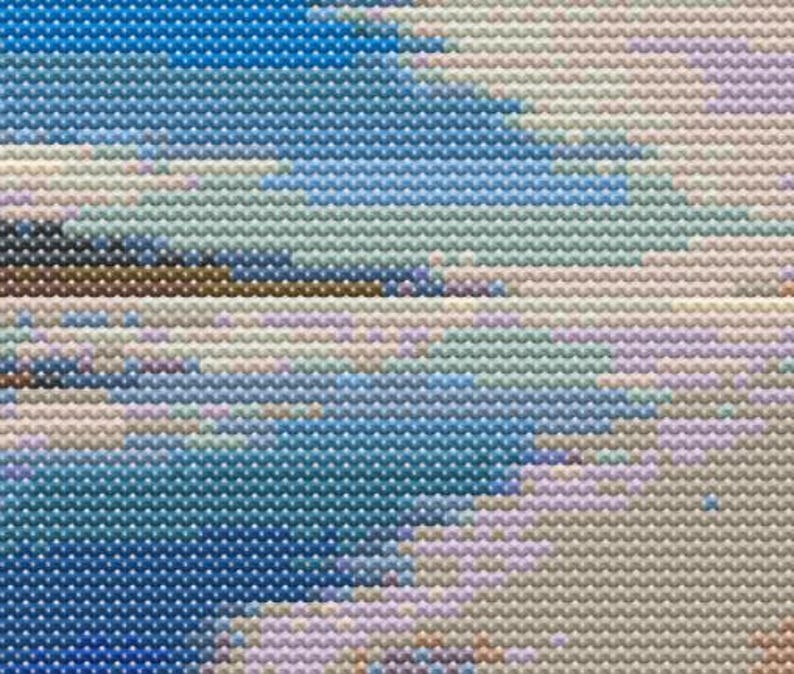 May include: Abstract painting with a pixelated effect. The painting features a blue, white, and brown colour scheme. The colours are arranged in a diagonal pattern.