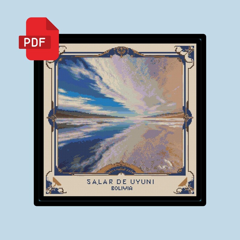 May include: A framed cross-stitch pattern of a landscape scene with a blue sky, white clouds, and a body of water. The text "SALAR DE UYUNI BOLIVIA" is at the bottom of the image.