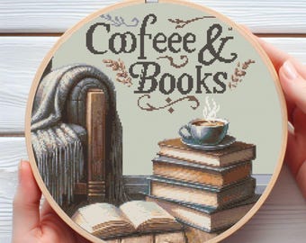 May include: A round embroidery hoop with a beige background and the text "Coffee & Books" in brown lettering. The image depicts a cozy scene with a stack of books, a cup of coffee, and a blanket draped over a chair.