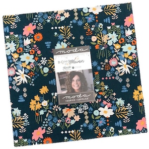 May include: A square fabric bundle with a dark teal background and a floral pattern in shades of pink, orange, yellow, and white. A tag reads "BOHO Haven" and "moda FABRICS + SUPPLIES".