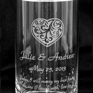 May include: A clear glass jar with a heart design and the text "Julie & Andrew May 25, 2013 Today, I will marry my best friend, the one I laugh with, live for, dream with, Love" engraved on the side.