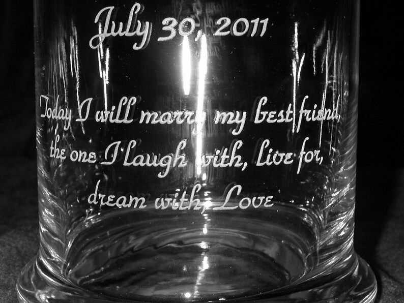 May include: A clear glass jar with the text "July 30, 2011" etched on the top. The text "Today I will marry my best friend, the one I laugh with, live for, dream with Love" is etched on the side of the jar.