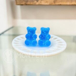 Blue sugar gummy bear stud earrings handmade in resin, close-up view