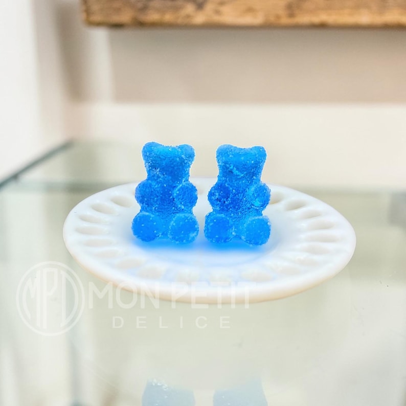 Blue sugar gummy bear stud earrings handmade in resin, close-up view