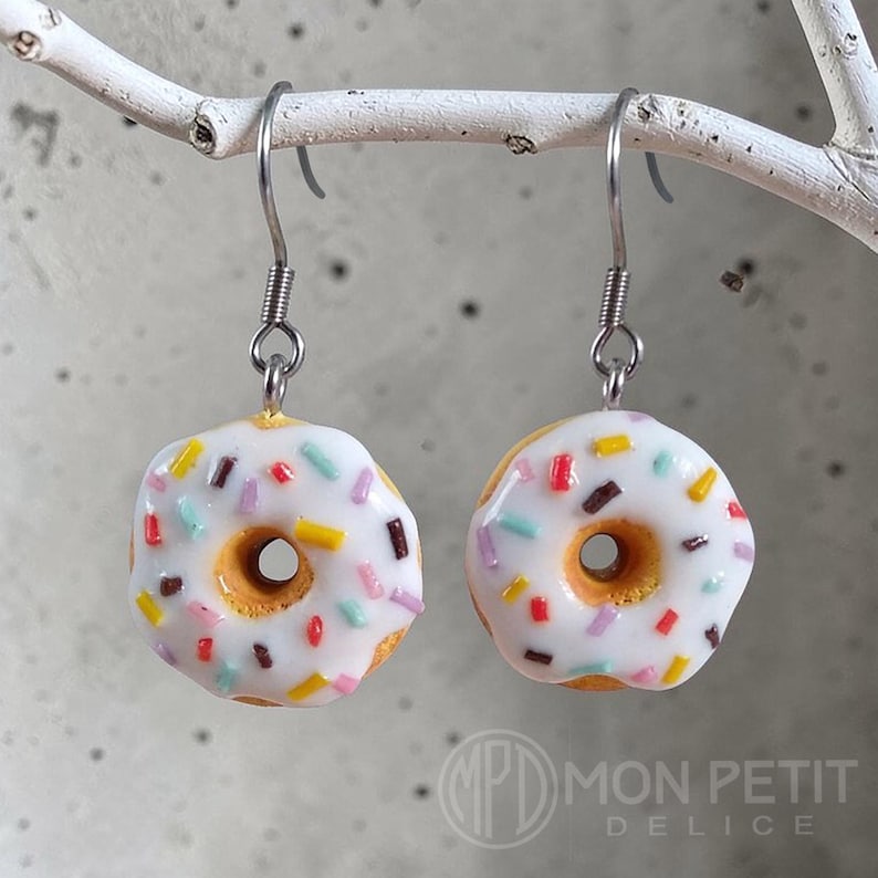 White sprinkle donut dangle earrings in polymer clay and surgical stainless steel.