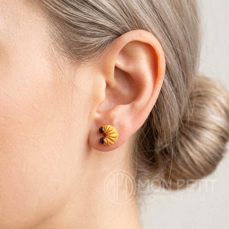 Lightweight croissant stud earring worn on a person's earlobe for everyday style.