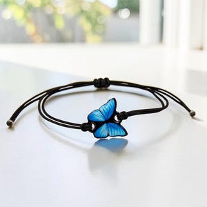 Adjustable blue butterfly bracelet cord. Durable jewelry handmade resin accessories for women, teens, and children. Great as matching friendship bracelets or a thoughtful gift for her.