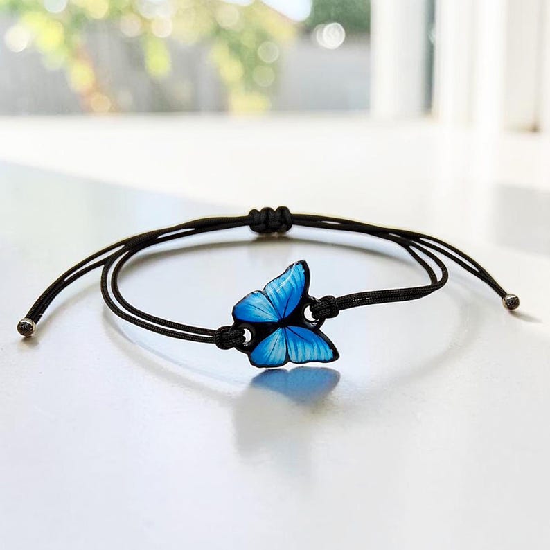 Adjustable blue butterfly bracelet cord. Durable jewelry handmade resin accessories for women, teens, and children. Great as matching friendship bracelets or a thoughtful gift for her.
