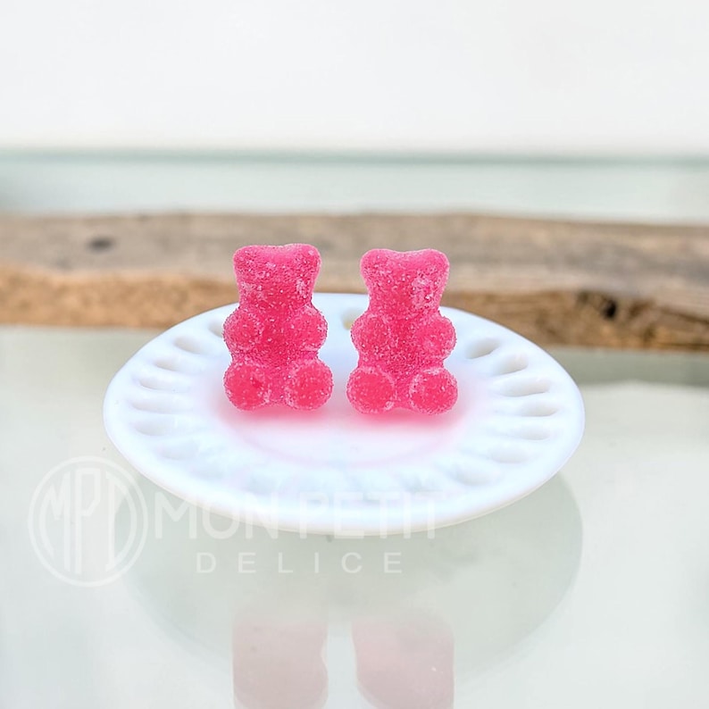 Red pink sugar gummy bear stud earrings handmade in resin, close-up view