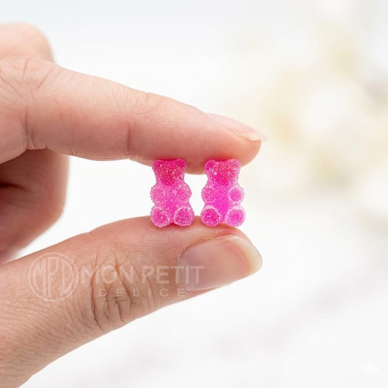 Handmade sugar gummy bears earrings shown on fingers to display size