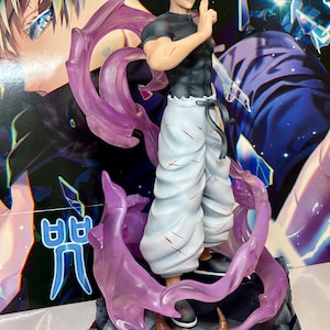 May include: A white and grey anime figurine of a character with white hair and a black shirt. The figurine is standing on a base with a skull and purple smoke effects. The base has the text "呼吸 廻戦" in Japanese.