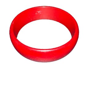 May include: A bright red plastic bangle bracelet.