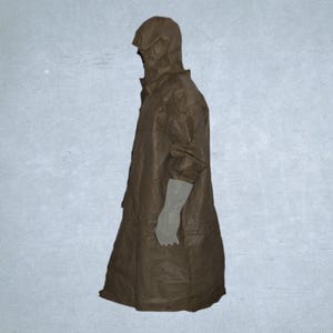 May include: A brown hooded raincoat with long sleeves and a button-up front. The coat is knee-length and has a loose fit. The sleeves end with light grey gloves. The raincoat is made of a crinkled material.