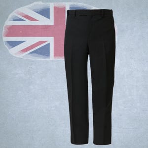 May include: A pair of black dress pants with a belt and a straight leg design. The pants are shown against a backdrop featuring the Union Jack flag.