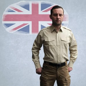 May include: A beige button-up shirt with two chest pockets, worn with brown cargo trousers and a black belt. The background shows a Union Jack flag design.