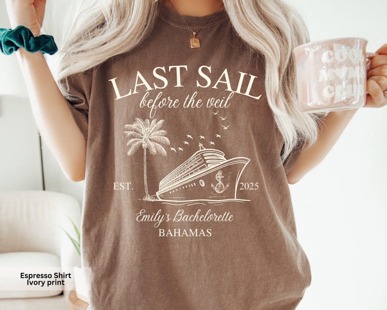 May include: Espresso brown t-shirt with an ivory print of a cruise ship, palm tree, and the text "LAST SAIL before the veil EST. 2025 Emily's Bachelorette BAHAMAS".