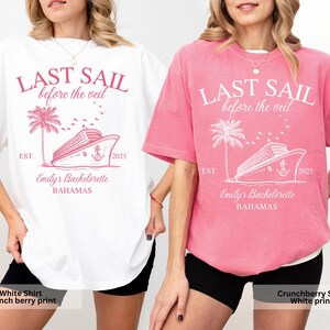 May include: Two t-shirts with the text "Last Sail Before the Veil" printed on them. The shirt on the left is white with pink text and the shirt on the right is pink with white text. Both shirts feature a cruise ship and palm tree graphic.