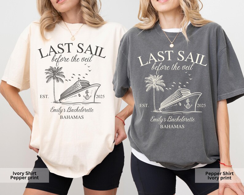 May include: Two t-shirts with a graphic design of a cruise ship and palm trees. The text on the shirts reads "Last Sail Before the Veil" and "Emily's Bachelorette Bahamas". One shirt is ivory with a pepper print and the other is pepper with an ivory print.