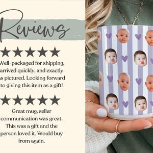 May include: White ceramic mug with a repeating pattern of baby faces and purple hearts on a light purple striped background. The mug has a white handle. The word "Reviews" is at the top of the image. The mug is held by a person.