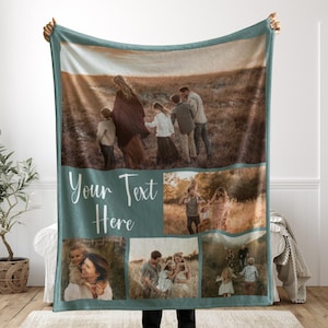 May include: A teal and cream-colored personalized photo blanket. The blanket features a large family photo and several smaller photos. The words "Your Text Here" are printed on the blanket. The blanket is held up by a person.