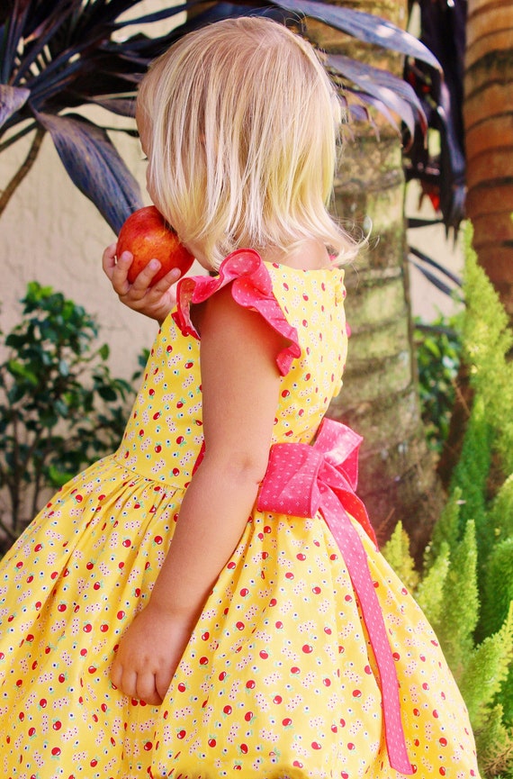 yellow dress with red apples