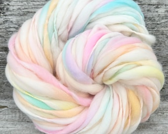 65 yards handspun merino wool yarn, cream and pastel rainbow, super bulky, thick and thin, 3.4 ounces/97 grams