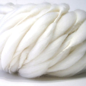 100 yards, 6.2 oz/176 grams super bulky handspun yarn, spun thick and thin in natural cream merino wool