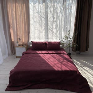 May include: A trio of ceramic mugs with a speckled, matte finish in light blue, cream, and grey. The mugs have a simple, modern design with a rounded shape and a comfortable handle.