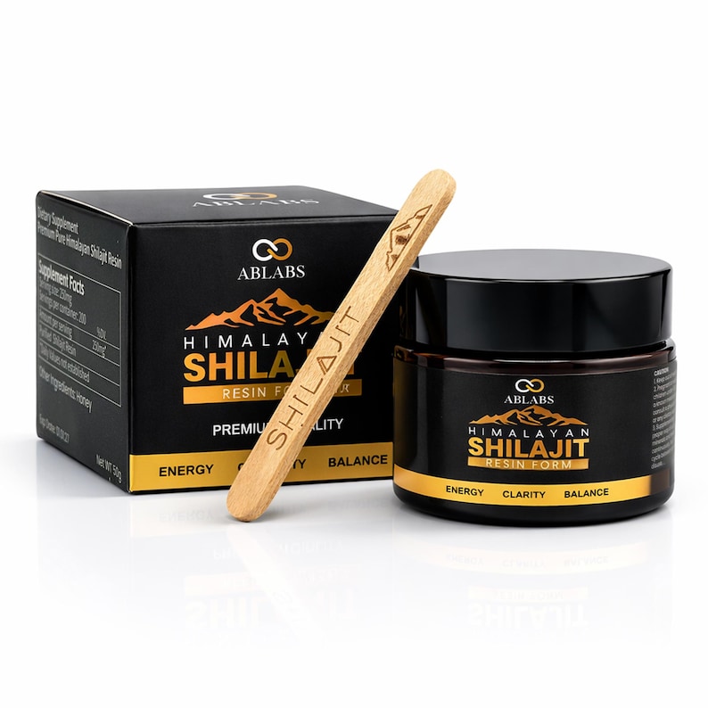 May include: A black box and jar of Himalayan Shilajit Resin Form with a wooden applicator. The box and jar have gold lettering and the brand name ABLABS. The text on the jar reads "Energy, Clarity, Balance."