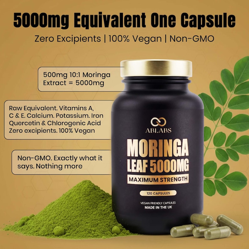 May include: A black bottle of Moringa Leaf 5000mg capsules with a gold cap, alongside a pile of green powder and several capsules. The label reads "Maximum Strength" and "120 Capsules". The text also states "Zero Excipients | 100% Vegan | Non-GMO".