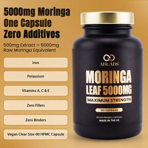 May include: A black supplement bottle with a gold cap and white text. The label reads "MORINGA LEAF 5000MG MAXIMUM STRENGTH" and lists "120 CAPSULES". Additional text highlights the product's features, including "Zero Additives" and "Vegan Friendly Capsules".