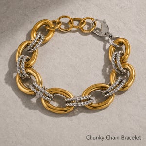 Bracciale a catena spessa in oro, argento e acciaio inossidabile, bracciale a maglie vistose e di carattere, gioiello moderno e massiccio per outfit cittadini grintosi.