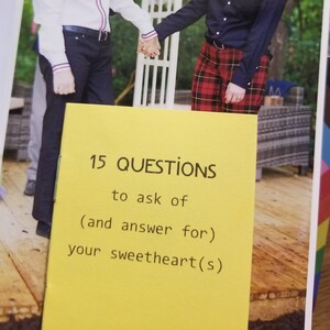 May include: A yellow card with the text "15 QUESTIONS to ask of (and answer for) your sweetheart(s)"