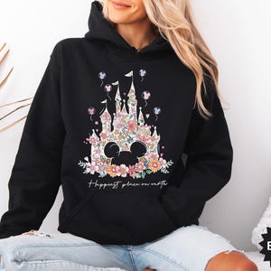 May include: Black hoodie with a floral design of a castle and the text "Happiest place on earth".