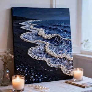 May include: A rectangular canvas painting depicting a dark ocean shoreline at night. The artwork features textured waves created with numerous white pearls of varying sizes, contrasting against a deep blue and black painted background.