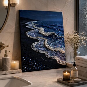 May include: A rectangular canvas painting depicting a dark blue ocean scene at night. The waves are formed by rows of white spherical pearls, while the dark sandy beach in the foreground is decorated with scattered dark blue and black pearls.