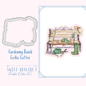 May include: A watercolor illustration of a gardening bench with a watering can, gloves, a potted plant, a rake, a hose, pruning shears, and a pair of green rubber boots. The text "Gardening Bench Cookie Cutter" is below the image.
